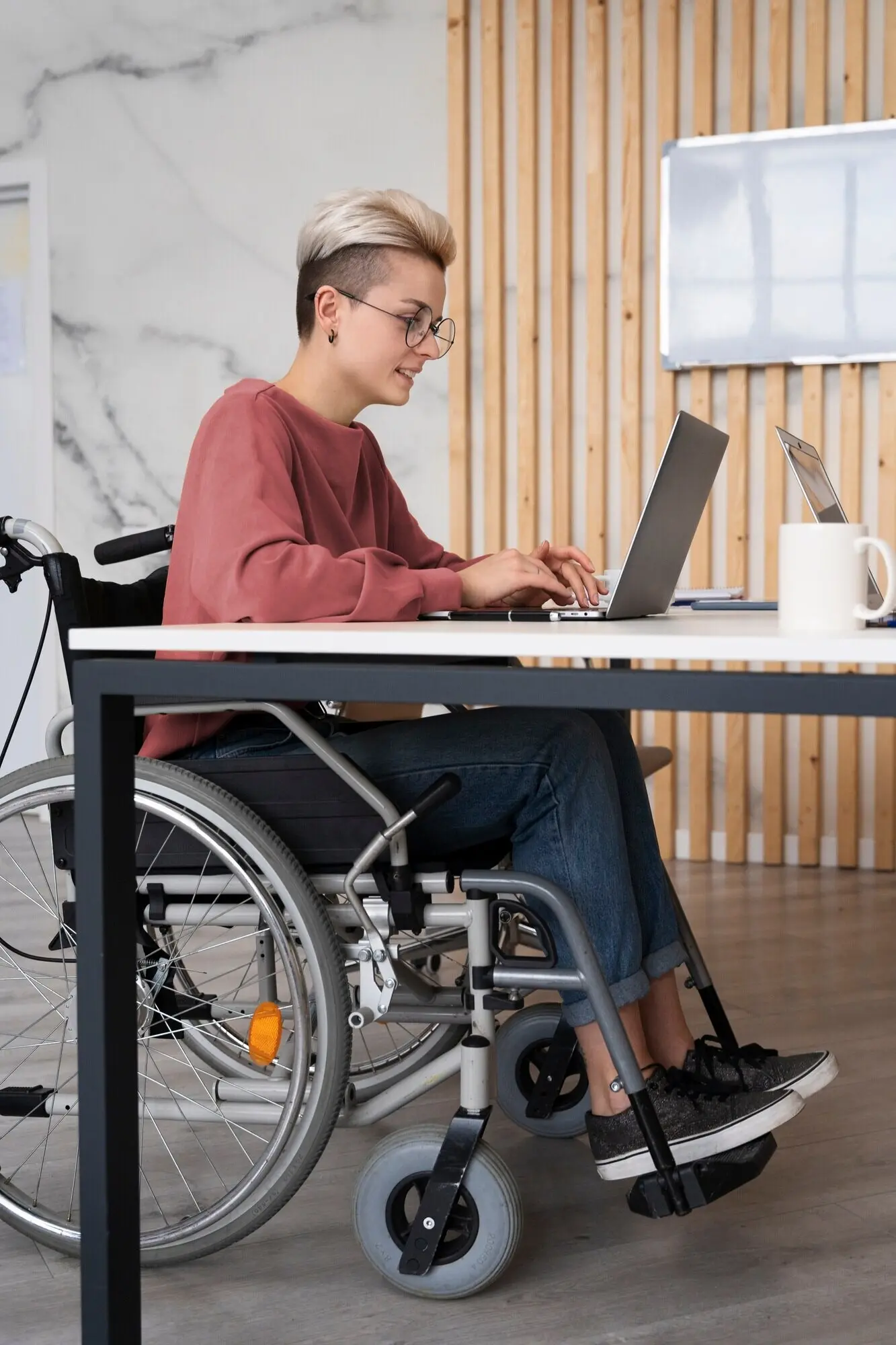 A young adult at work in a social integration workspace.