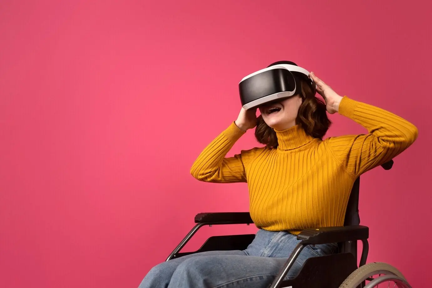 Portrait of a woman with a disability in a wheelchair wearing VR glasses