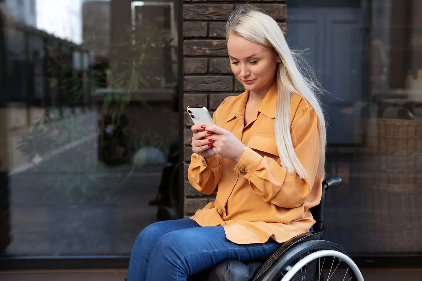 A disabled individual in a wheelchair on the street